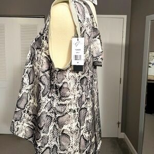 Gracia: Black and Silver Top with shimmering silver trim on the short sleeves